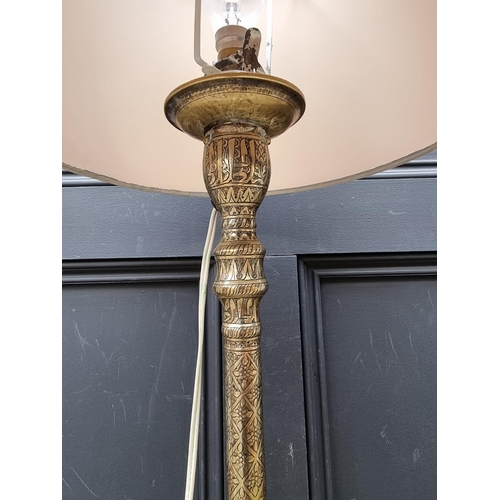 1058 - An interesting Islamic brass table lamp, height excluding fitting 52cm.