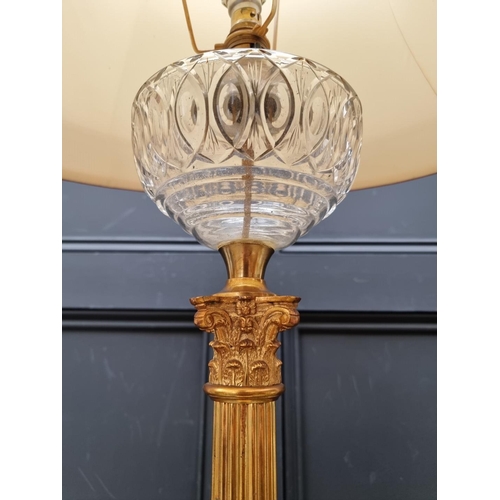 1059 - A gilt brass Corinthian column table lamp, (converted). 