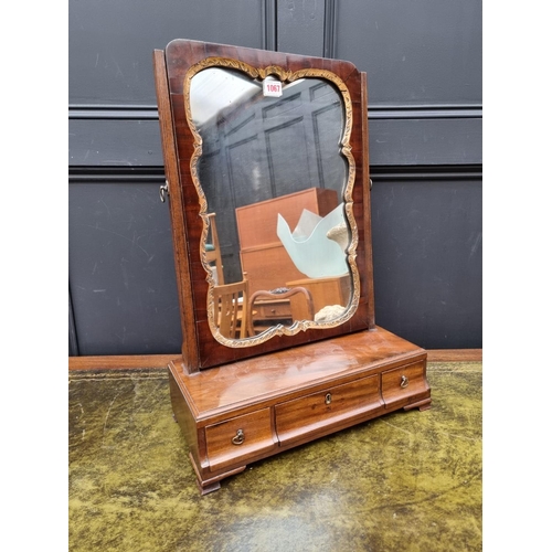 1067 - A George III mahogany toilet mirror, 43cm wide. 