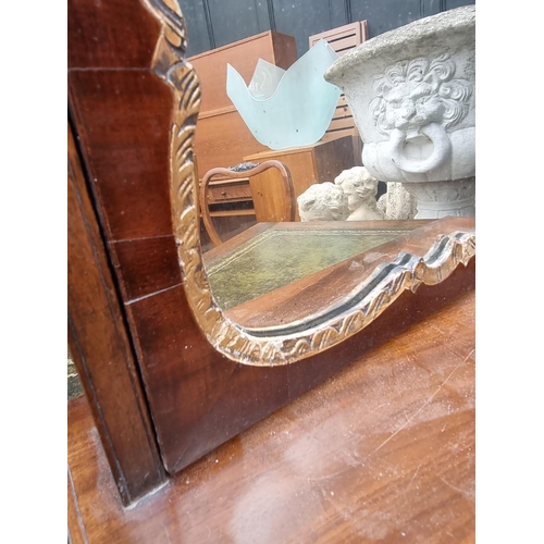 1067 - A George III mahogany toilet mirror, 43cm wide. 