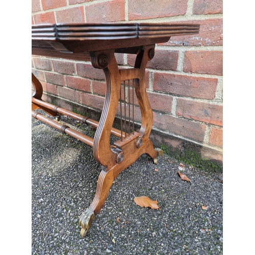 1072 - A reproduction mahogany and leather top low occasional table, 90cm wide.