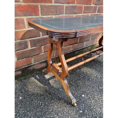 1072 - A reproduction mahogany and leather top low occasional table, 90cm wide.