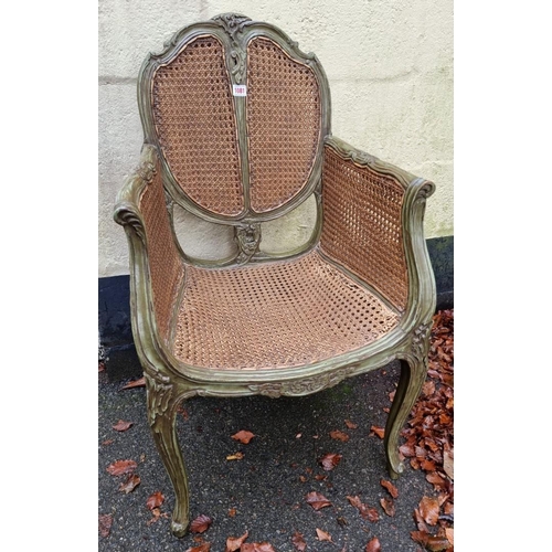 1081 - A small Louis XV style green painted and double cane bergere chair, (s.d. to seat).  ... 