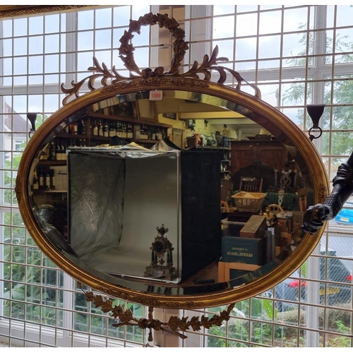 1089 - A Victorian gilt framed oval wall mirror, 75.5 x 77.5cm.