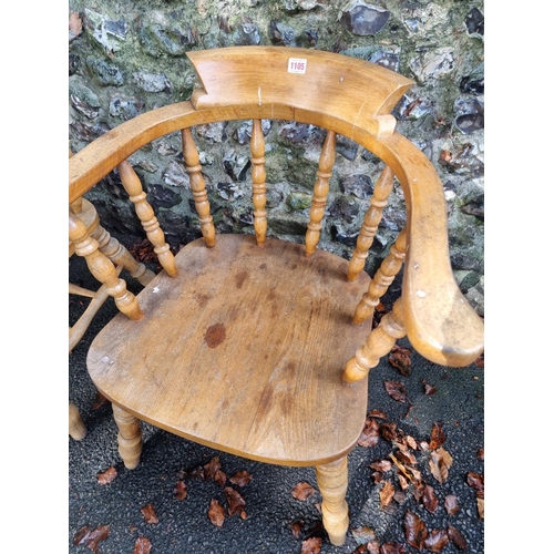 1105 - A pair of beech and elm smokers bow chairs. 