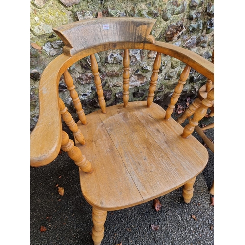 1105 - A pair of beech and elm smokers bow chairs. 