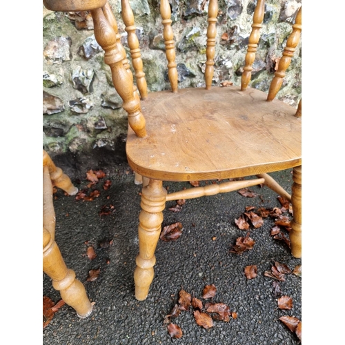 1106 - A pair of beech and elm smokers bow chairs.Ensuite with the previous lot.