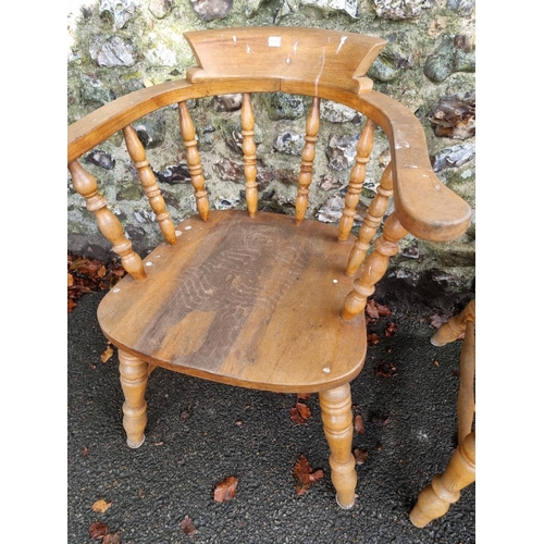 1106 - A pair of beech and elm smokers bow chairs.Ensuite with the previous lot.