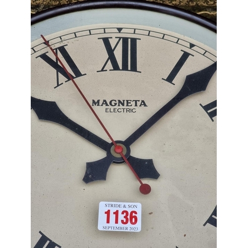 1136 - A vintage Magneta electric brown Bakelite wall clock, 35.5cm diameter.