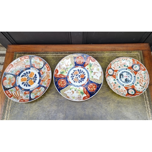 1140 - Three Japanese Imari chargers, largest 37.5cm diameter.