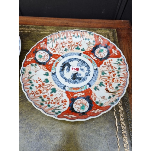 1140 - Three Japanese Imari chargers, largest 37.5cm diameter.