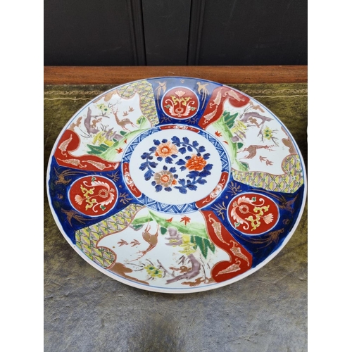 1140 - Three Japanese Imari chargers, largest 37.5cm diameter.