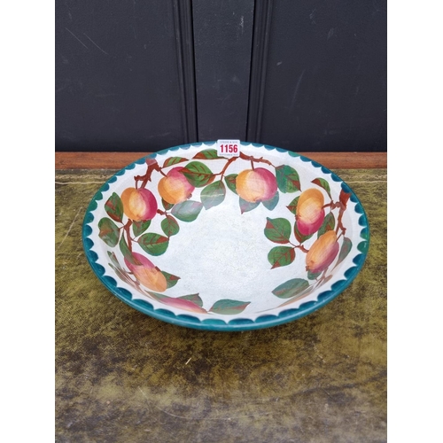 1156 - A Wemyss pottery bowl, painted with apples, 29cm diameter, (extensive restoration).