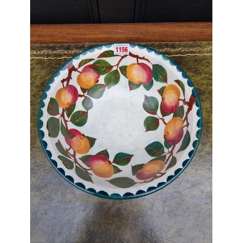 1156 - A Wemyss pottery bowl, painted with apples, 29cm diameter, (extensive restoration).