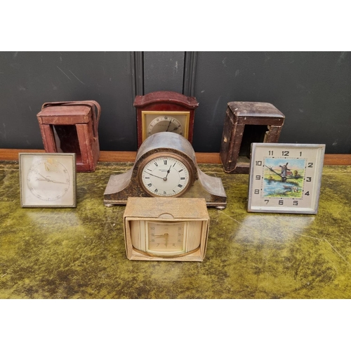 1163 - A small group of vintage clocks and timepieces, to include two leather carriage clock cases. (7... 