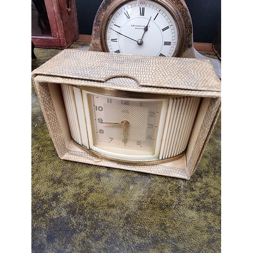 1163 - A small group of vintage clocks and timepieces, to include two leather carriage clock cases. (7... 