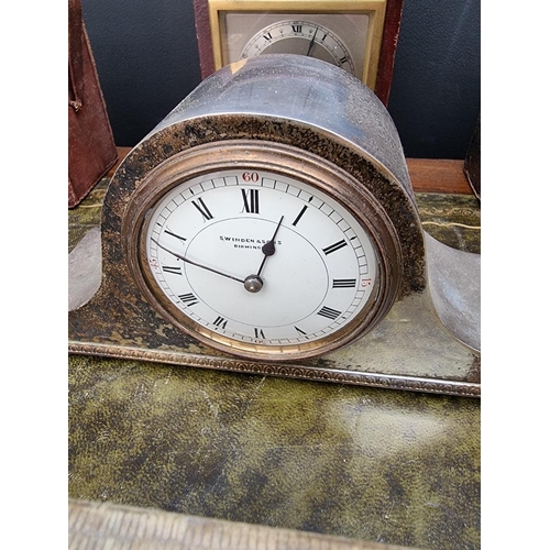 1163 - A small group of vintage clocks and timepieces, to include two leather carriage clock cases. (7... 