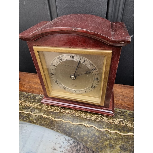 1163 - A small group of vintage clocks and timepieces, to include two leather carriage clock cases. (7... 