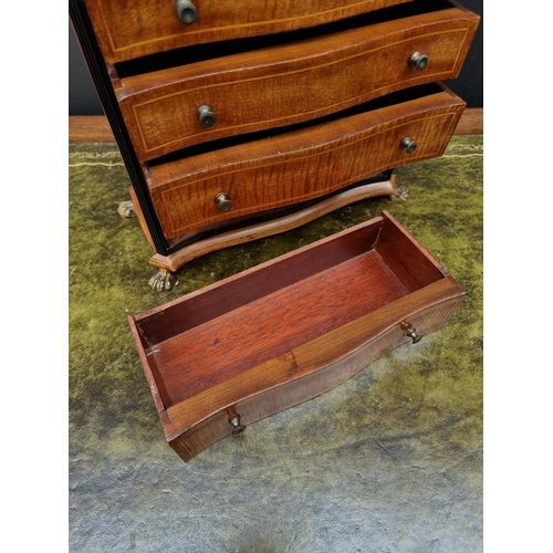 1165 - An early 20th century mahogany, ebonized and line inlaid miniature chest of drawers, 27.5cm hig... 