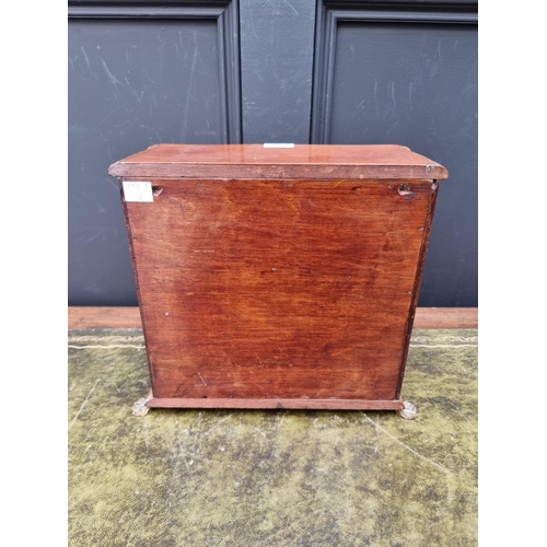 1165 - An early 20th century mahogany, ebonized and line inlaid miniature chest of drawers, 27.5cm hig... 