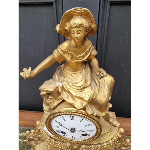 1180 - A gilt spelter mantel clock, 40cm high, with pendulum. 