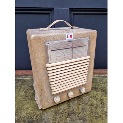 1186 - A vintage HMV portable combined radio and record player, model No.1507.