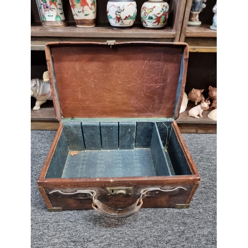 1341 - An old tan leather and brass bound shotgun cartridge case, 47.5cm wide.