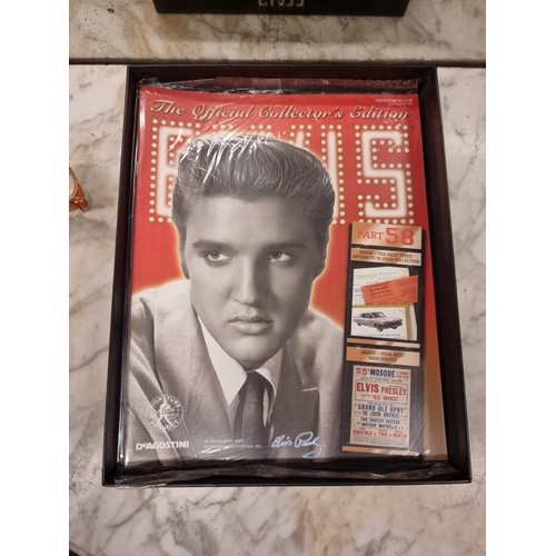 1352 - A collection of reproduction Elvis Presley ephemera and memorabilia, boxed.... 