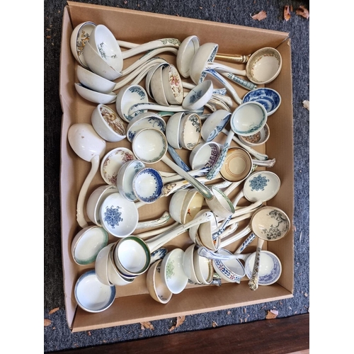 1354 - A collection of Victorian and later sauce ladles. (approx 50)