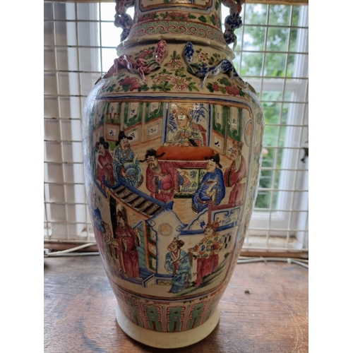 1454 - A large Chinese famille rose twin handled vase, 19th century, 62.5cm high, (cracks). ... 