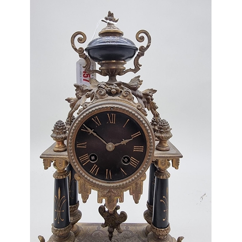 1457 - A Louis XVI style gilt metal mantel clock, 39cm high.