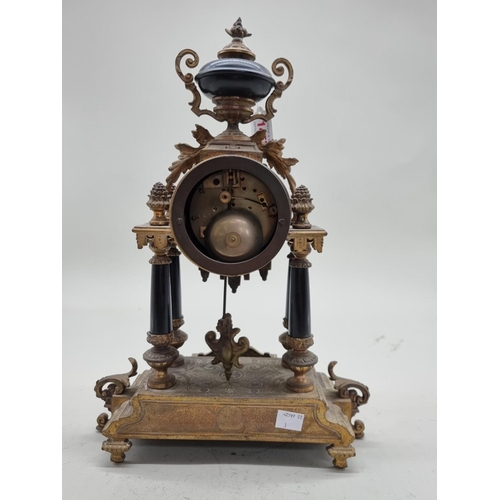 1457 - A Louis XVI style gilt metal mantel clock, 39cm high.