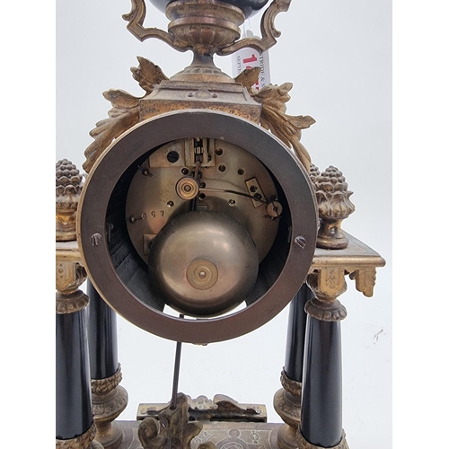 1457 - A Louis XVI style gilt metal mantel clock, 39cm high.