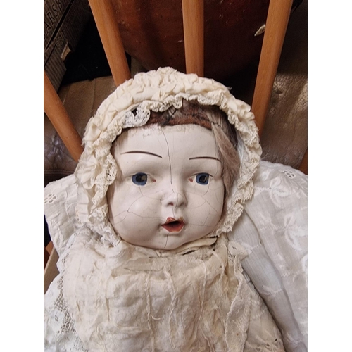 1505 - An antique Continental doll, with composition head, wearing lace bonnet and dress.