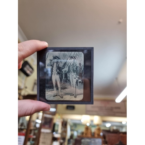 1531 - A collection of forty nine magic lantern slides, in pine box.