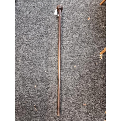 1541 - A knobkerrie style hardwood cane, 90cm long. 