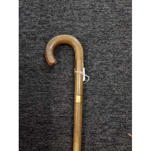 1542 - A rhinoceros horn walking stick, by Brigg, London, initialled and dated 1919.  ... 