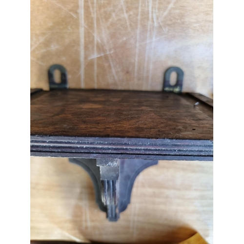 1554 - A painted wood wall bracket, 33.5cm wide x 47cm high; together with another carved oak wall bracket;... 