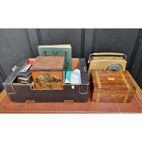 1561 - WITHDRAWN FROM SALE A mixed lot, to include a vintage style radio, cigarette cards, autographs, post... 