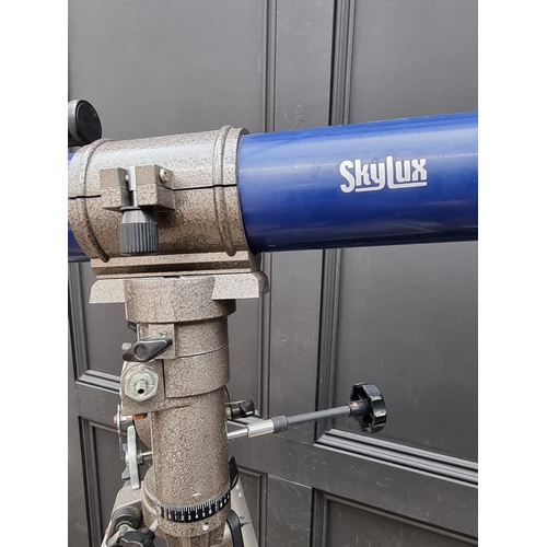 1565 - A Skylux telescope, on tripod.