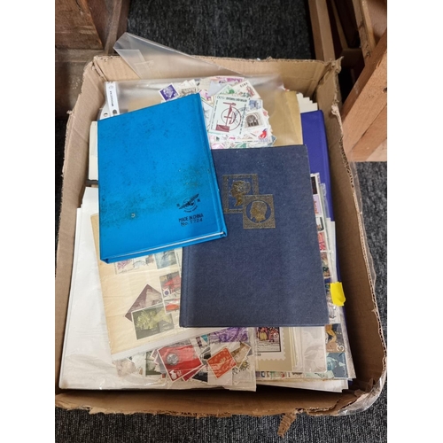 912 - STAMPS & FIRST DAY COVERS: a collection in small box. 