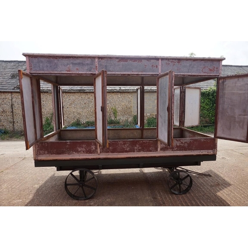 1548A - An early 20th century aluminium circus wagon, on four wheel base, 300cm long x 137.5cm wide x 2... 