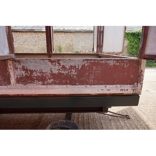 1548A - An early 20th century aluminium circus wagon, on four wheel base, 300cm long x 137.5cm wide x 2... 