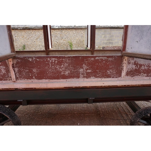 1548A - An early 20th century aluminium circus wagon, on four wheel base, 300cm long x 137.5cm wide x 2... 