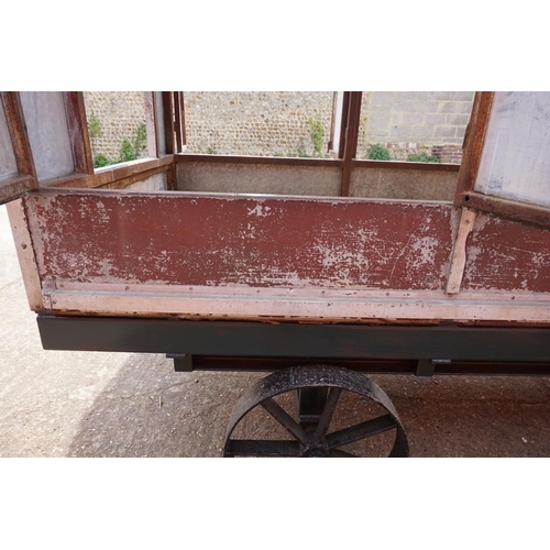 1548A - An early 20th century aluminium circus wagon, on four wheel base, 300cm long x 137.5cm wide x 2... 