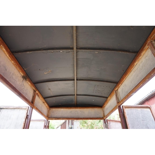 1548A - An early 20th century aluminium circus wagon, on four wheel base, 300cm long x 137.5cm wide x 2... 