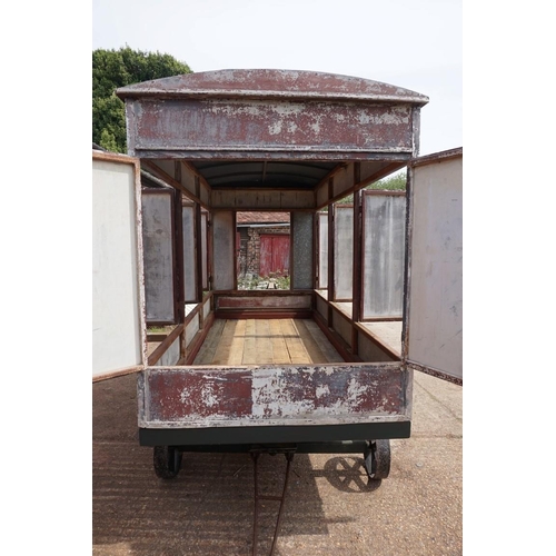 1548A - An early 20th century aluminium circus wagon, on four wheel base, 300cm long x 137.5cm wide x 2... 