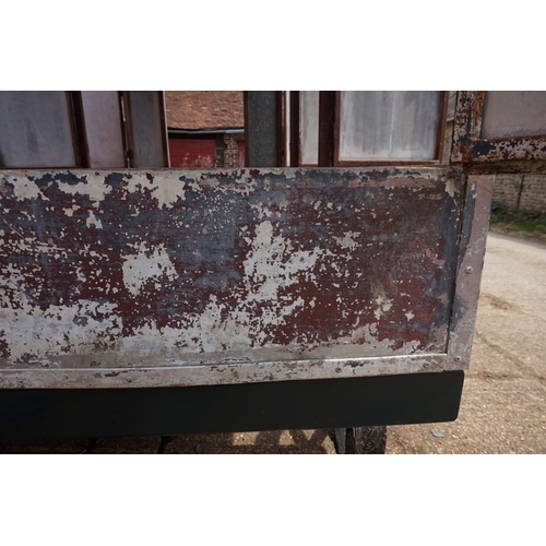 1548A - An early 20th century aluminium circus wagon, on four wheel base, 300cm long x 137.5cm wide x 2... 