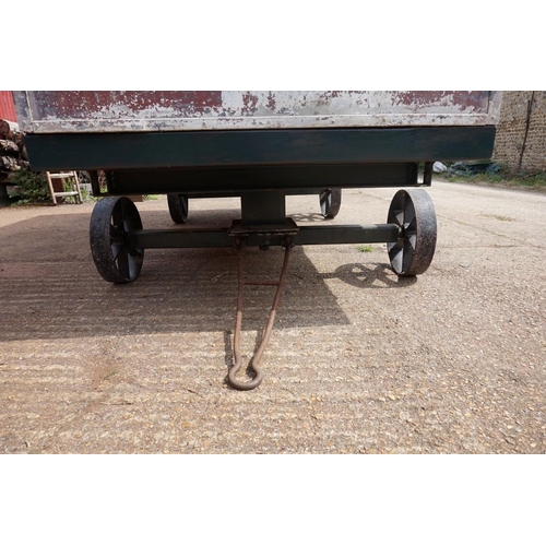 1548A - An early 20th century aluminium circus wagon, on four wheel base, 300cm long x 137.5cm wide x 2... 