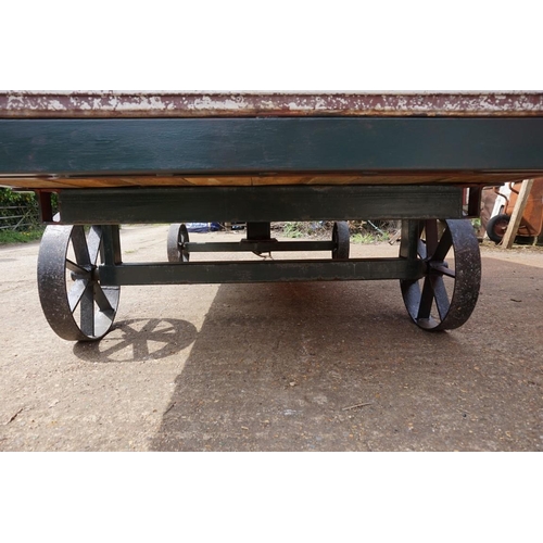 1548A - An early 20th century aluminium circus wagon, on four wheel base, 300cm long x 137.5cm wide x 2... 